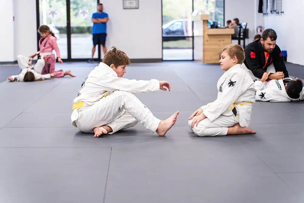 2 kids jiu jitsu students training together with great self confidence at Raposo BJJ Academy in Slidell LA