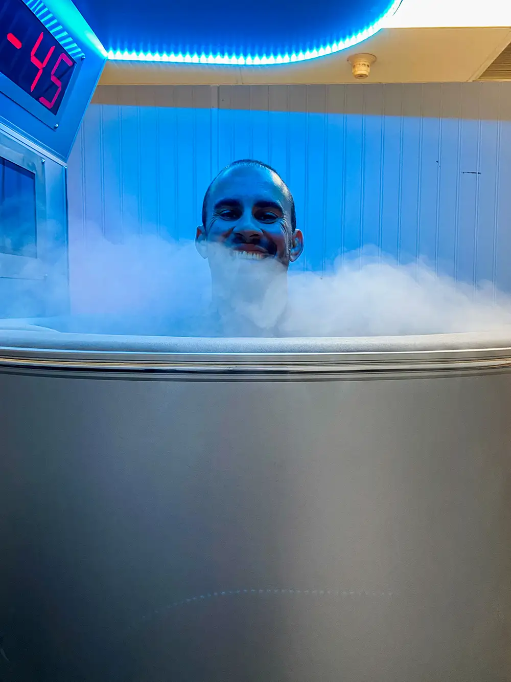 An image of a customer using the cryotherapy machine next to a description of what cryotherapy is at Raposo BJJ Academy in Slidell LA